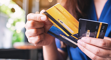 woman holding credit cards